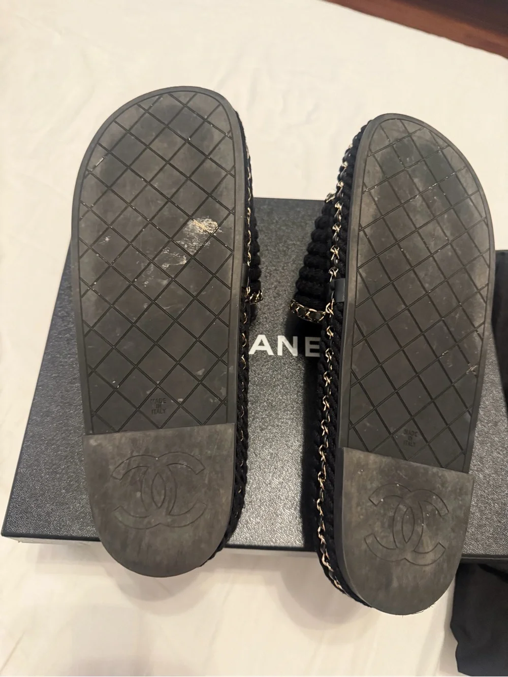 CHANEL Black Braided Slides with Gold Chain Accents